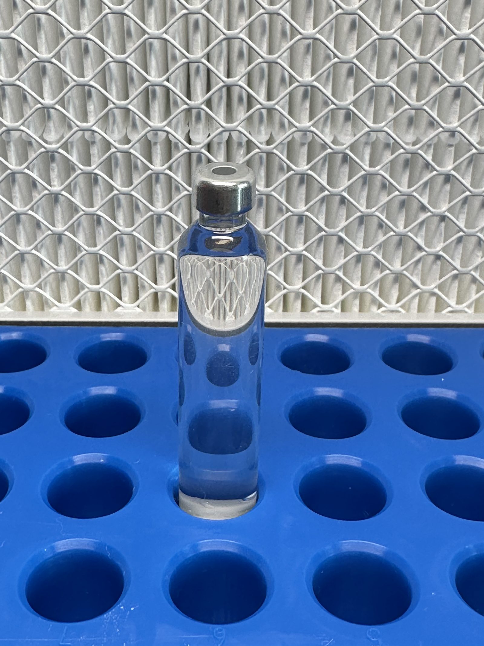 Lyophilized vial on blue tray
